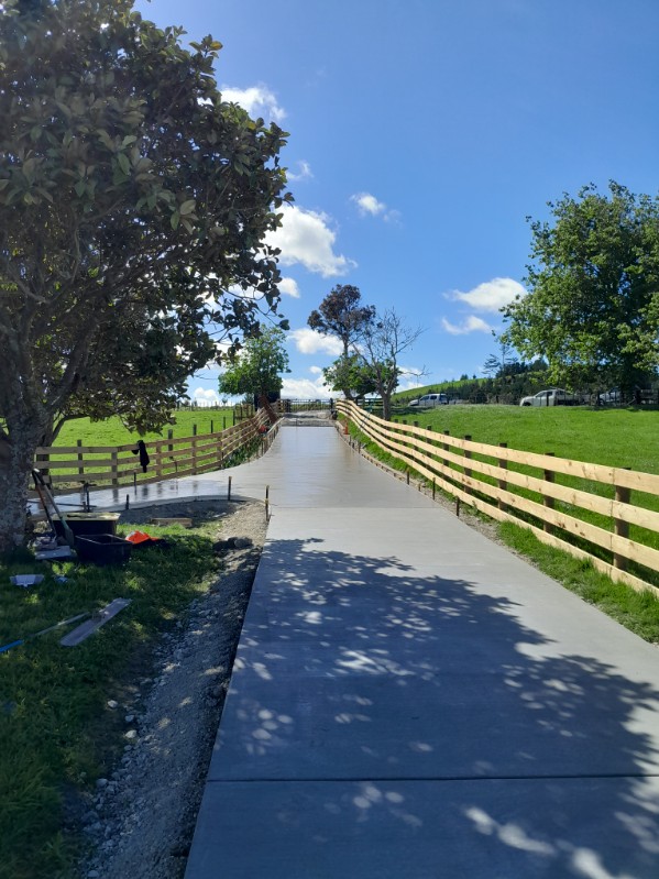 Long concrete driveway laid by Coastline Concrete through a rural property in the Mangawhai area